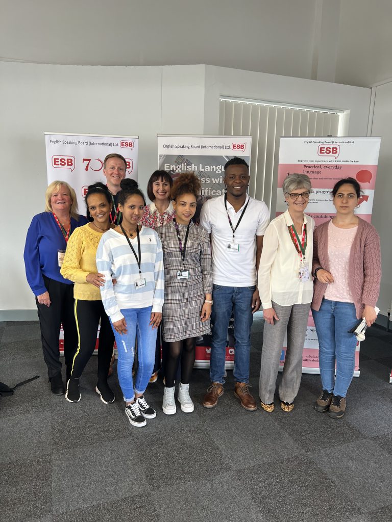 A group photo including Tina Renshaw taken at ESB International's 70th anniversary celebration at New City College.